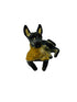Xolo mini negro echado lado izquierdo con sueter amarillo