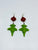 Colibri verde con flor roja